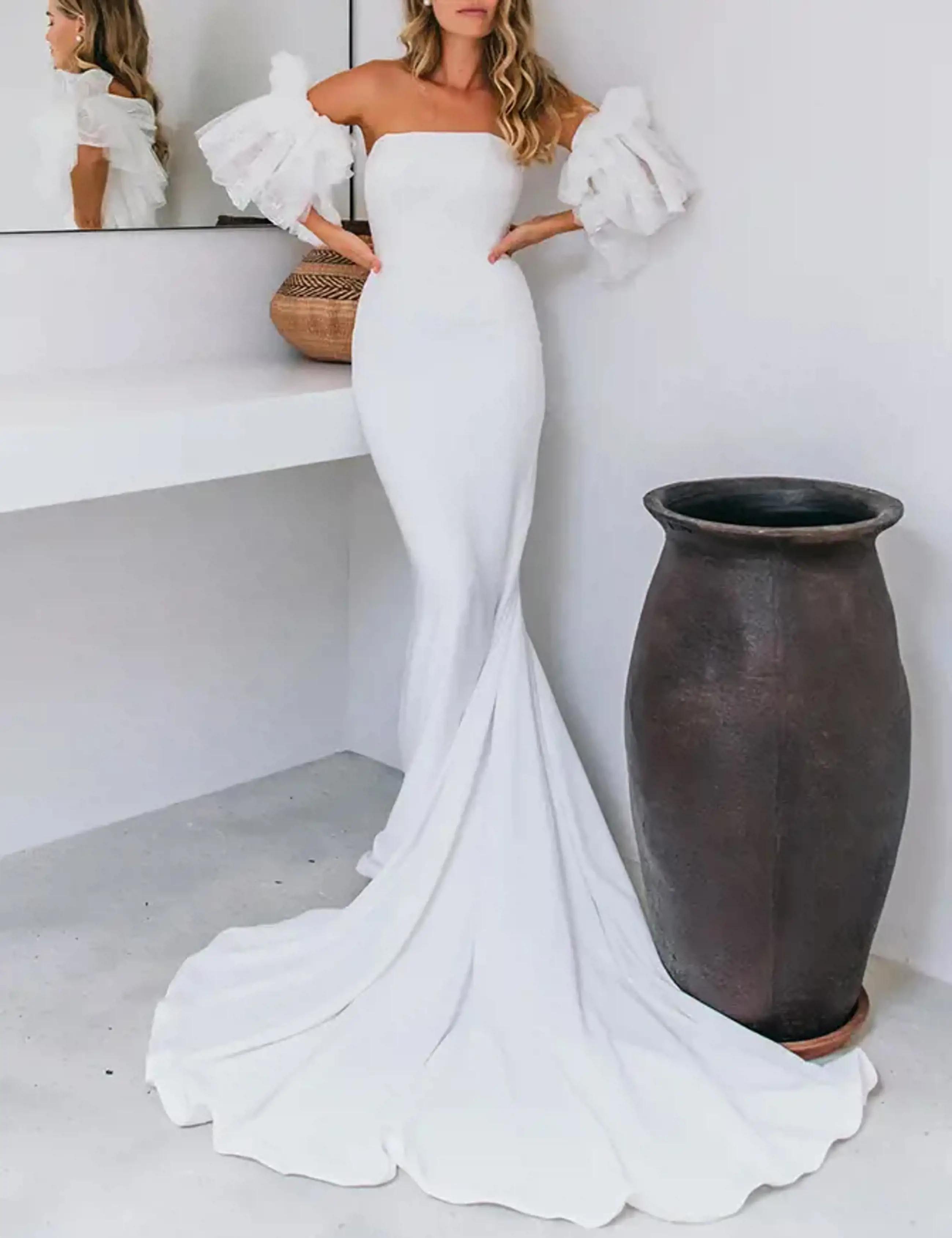 Model wearing a Emmy Mae gown