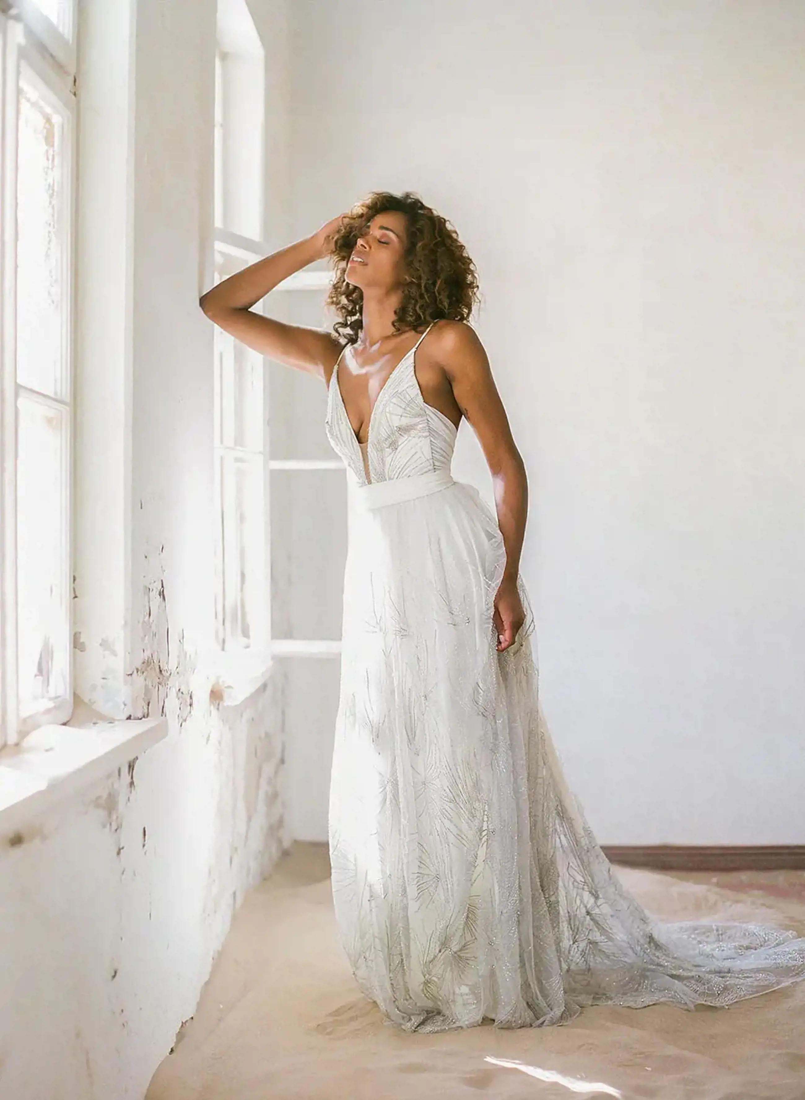 Model wearing a Truvelle gown